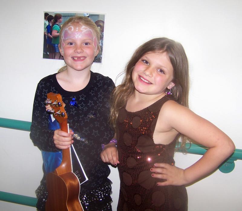 Lila Hurburt, left, and Lila Bangs wait backstage before performing at the Sippican School talent show. BY MATTHEW BERNAT